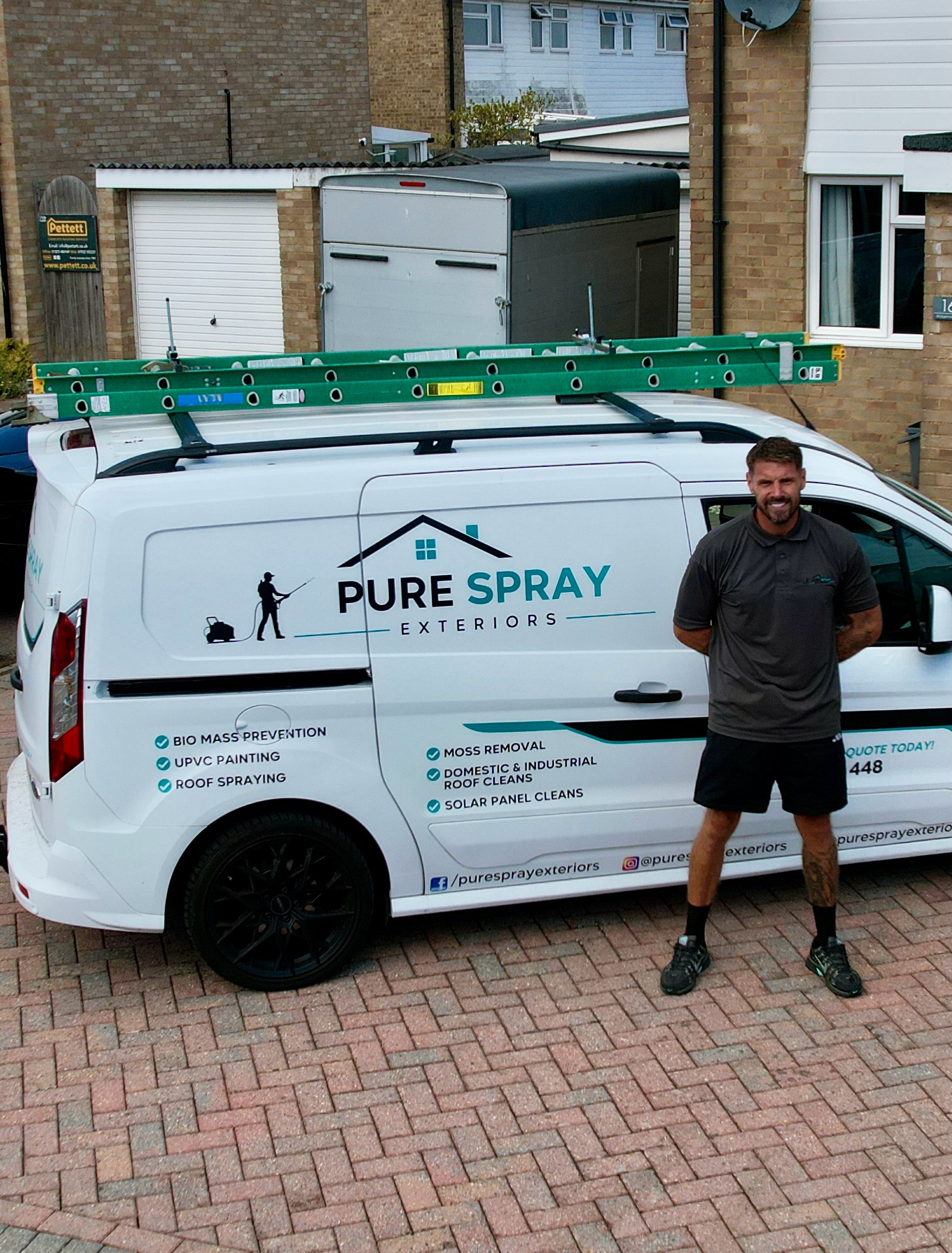 Jason, owner of Pure Spray Exteriors, beside his branded work van