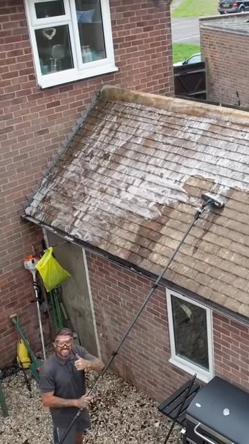 Pure Spray carrying out roof cleaning on a Sussex home